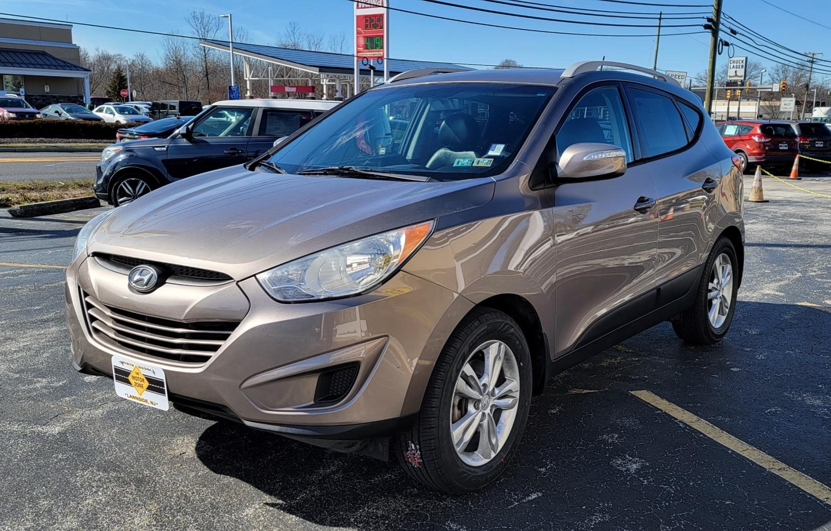 2012 Brown /Black Hyundai Tucson Limited (KM8JUCAC7CU) with an 4-Cyl, PZEV, 2.4 Liter engine, Automatic transmission, located at 341 N White Horse Pike, Lawnside, NJ, 08045, (856) 262-9500, 39.855621, -75.027451 - Photo#1